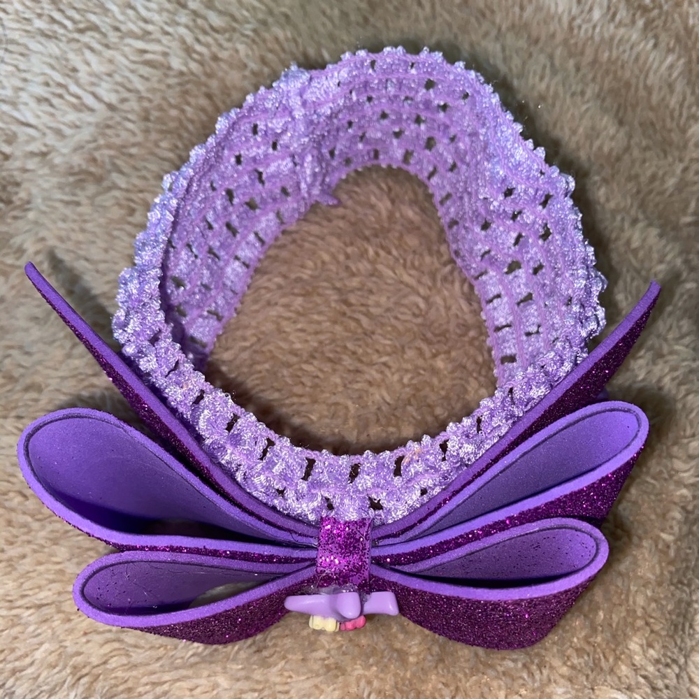 Purple head band with bow.
